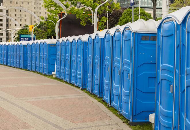 a row of portable restrooms set up for a large athletic event, allowing participants and spectators to easily take care of their needs in Berkeley, IL